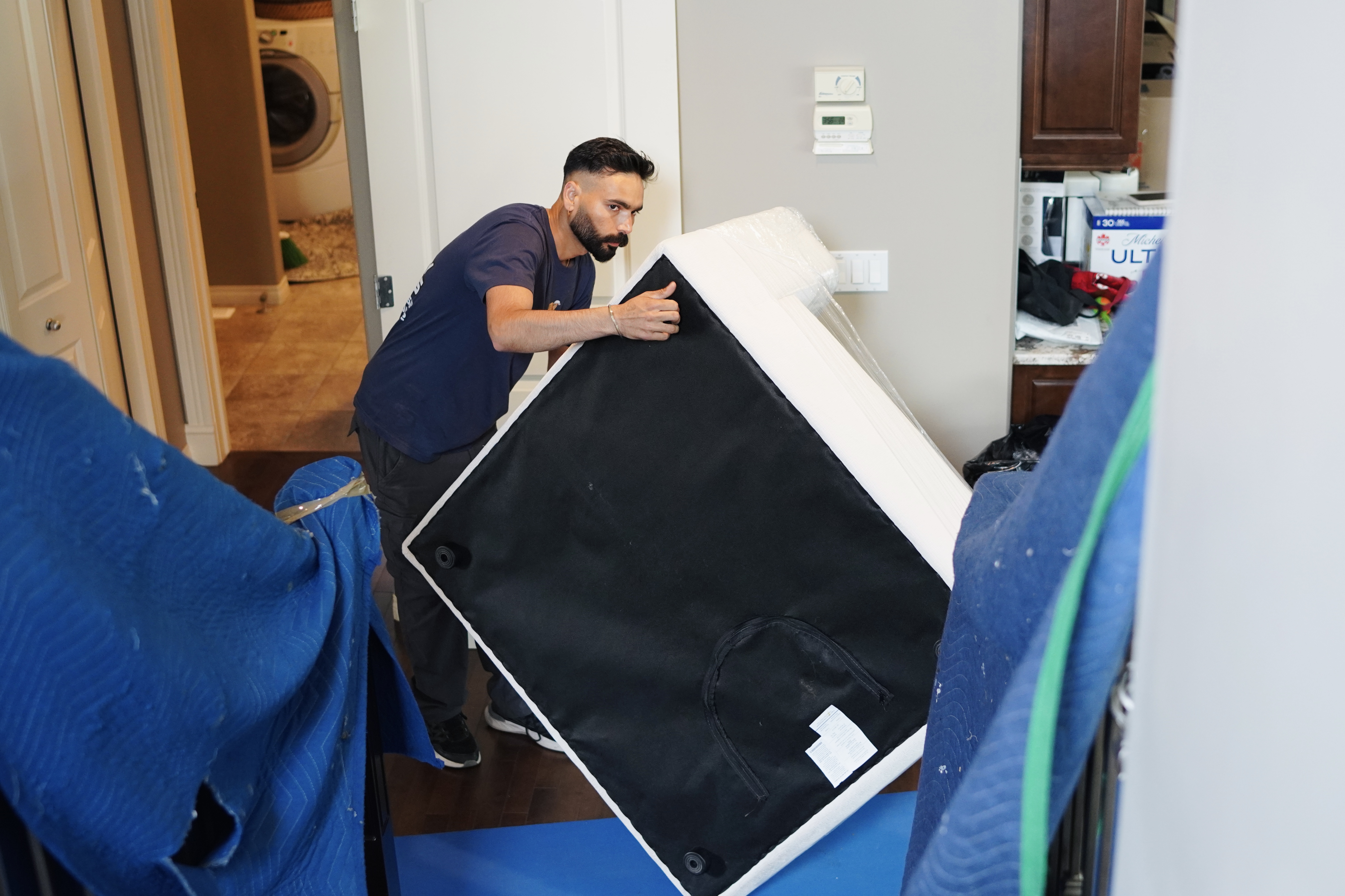 Family packing boxes together before a move