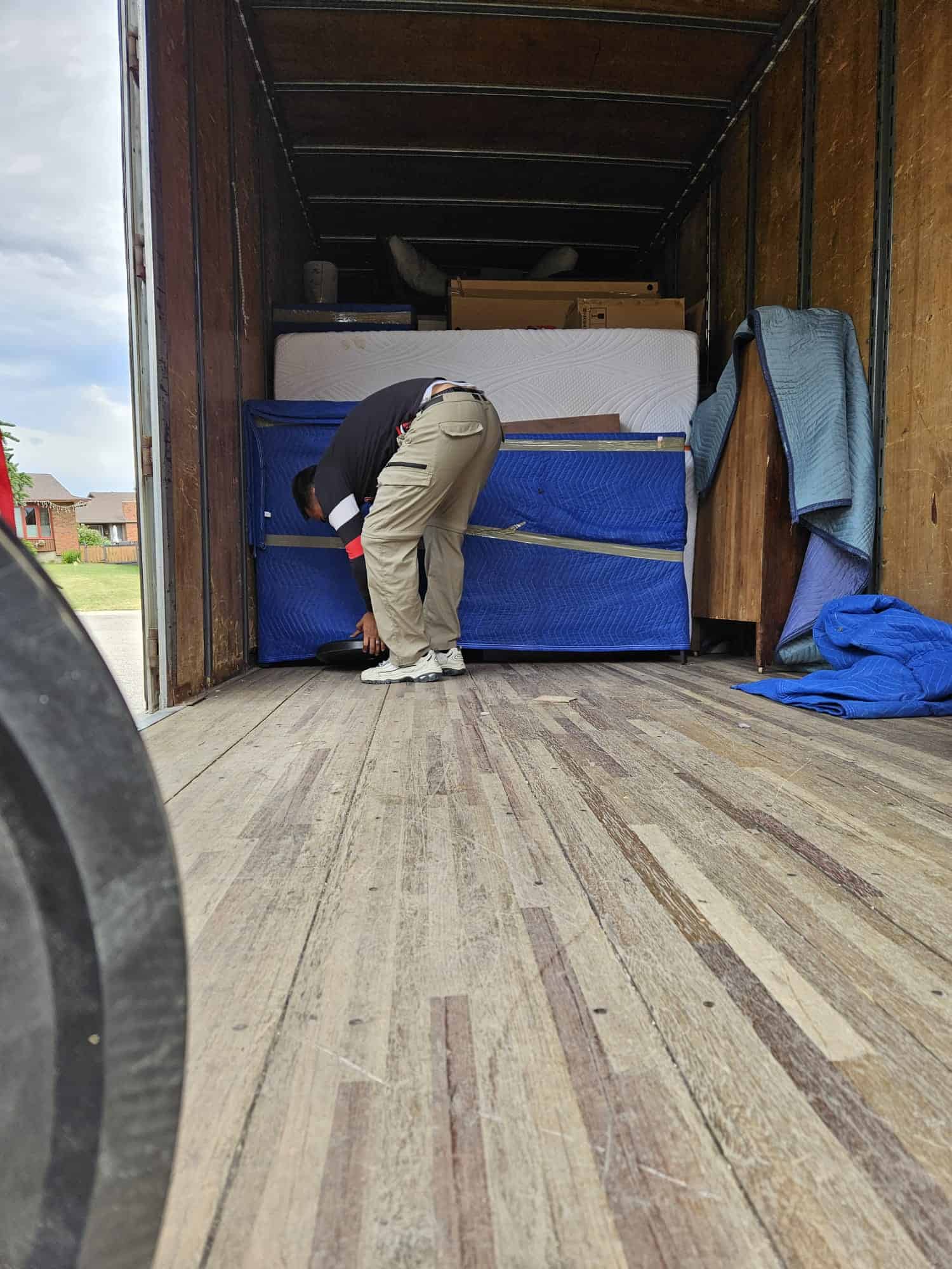Moving truck interior with packed furniture and boxes, ready for a move in Calgary.