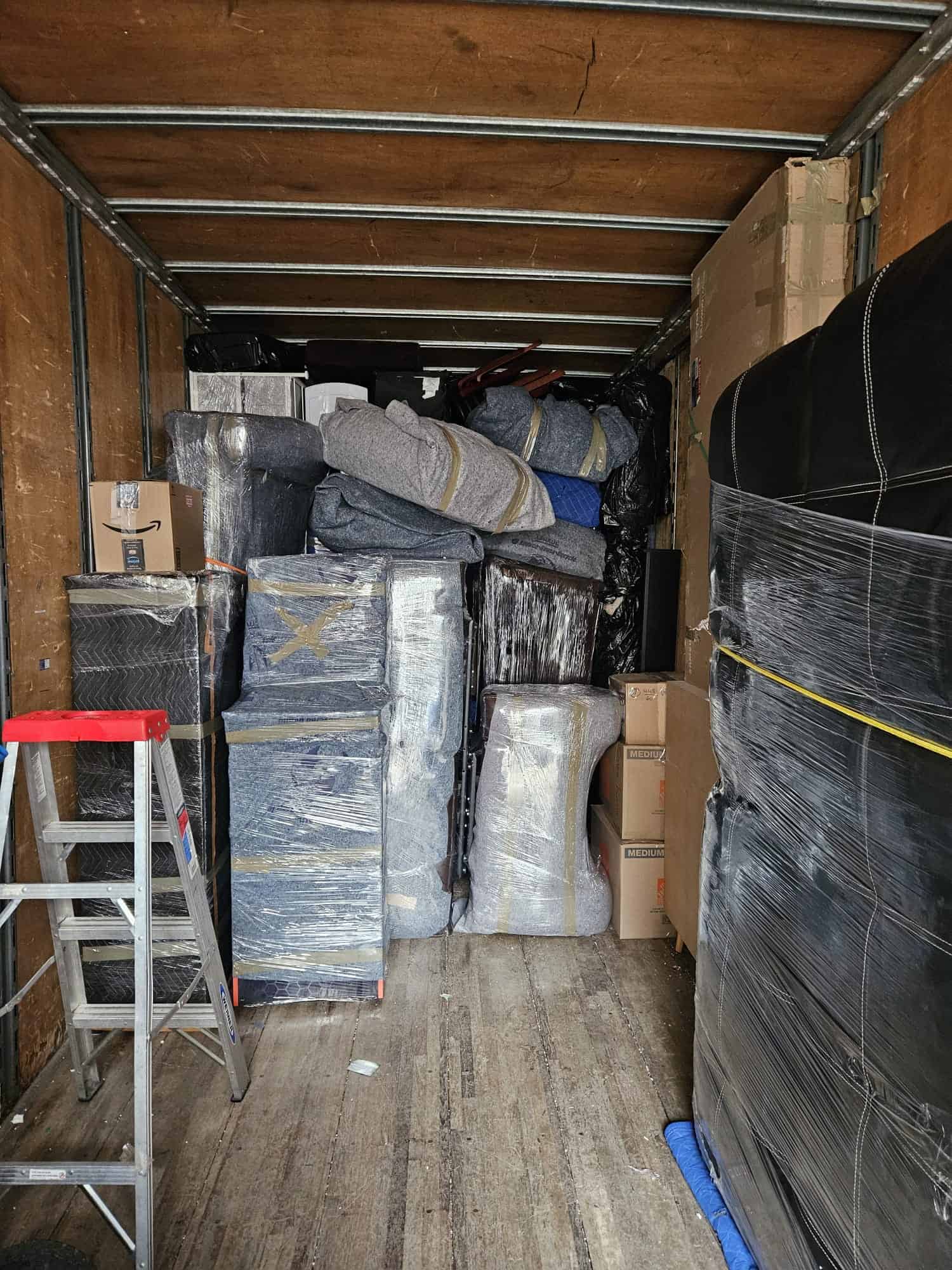 Professional movers loading a moving truck