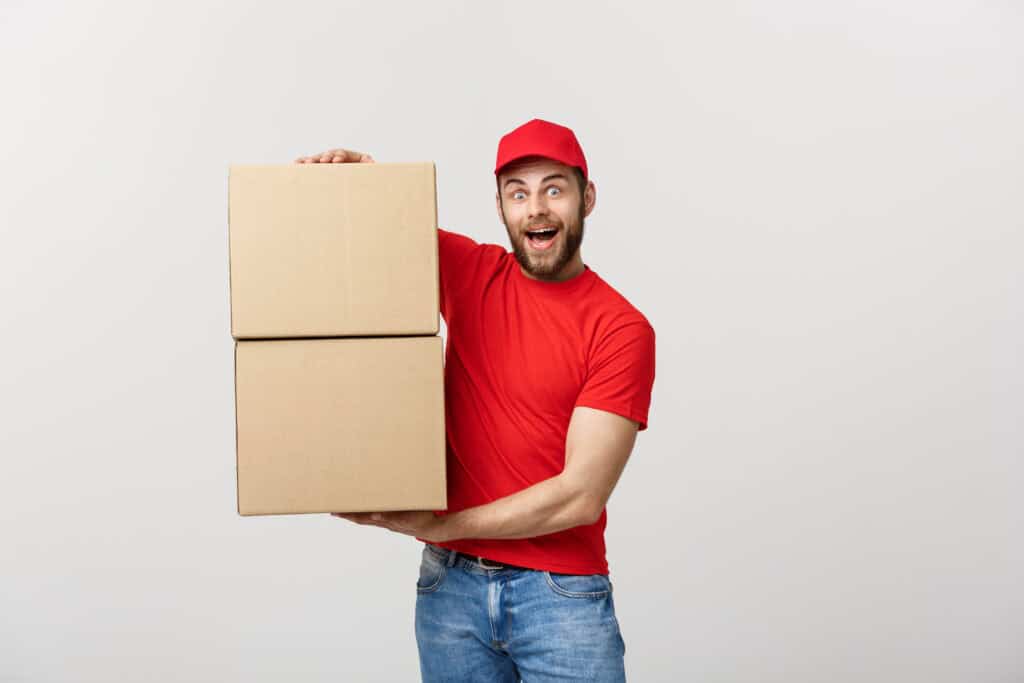 Professional mover holding two moving boxes