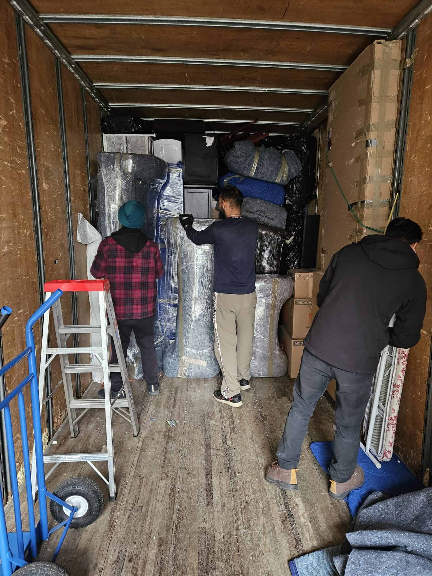 Moving team loading furniture and boxes in Coaldale