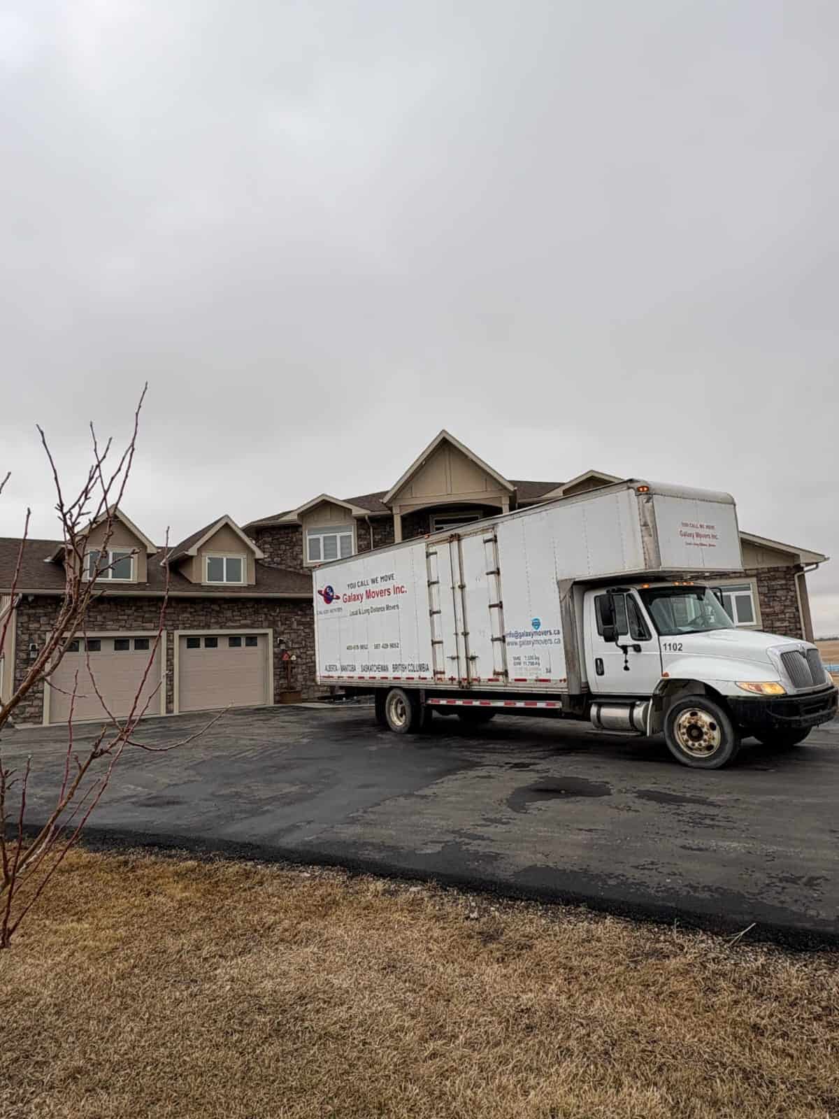 Moving truck parked in front of a house in Spruce Grove