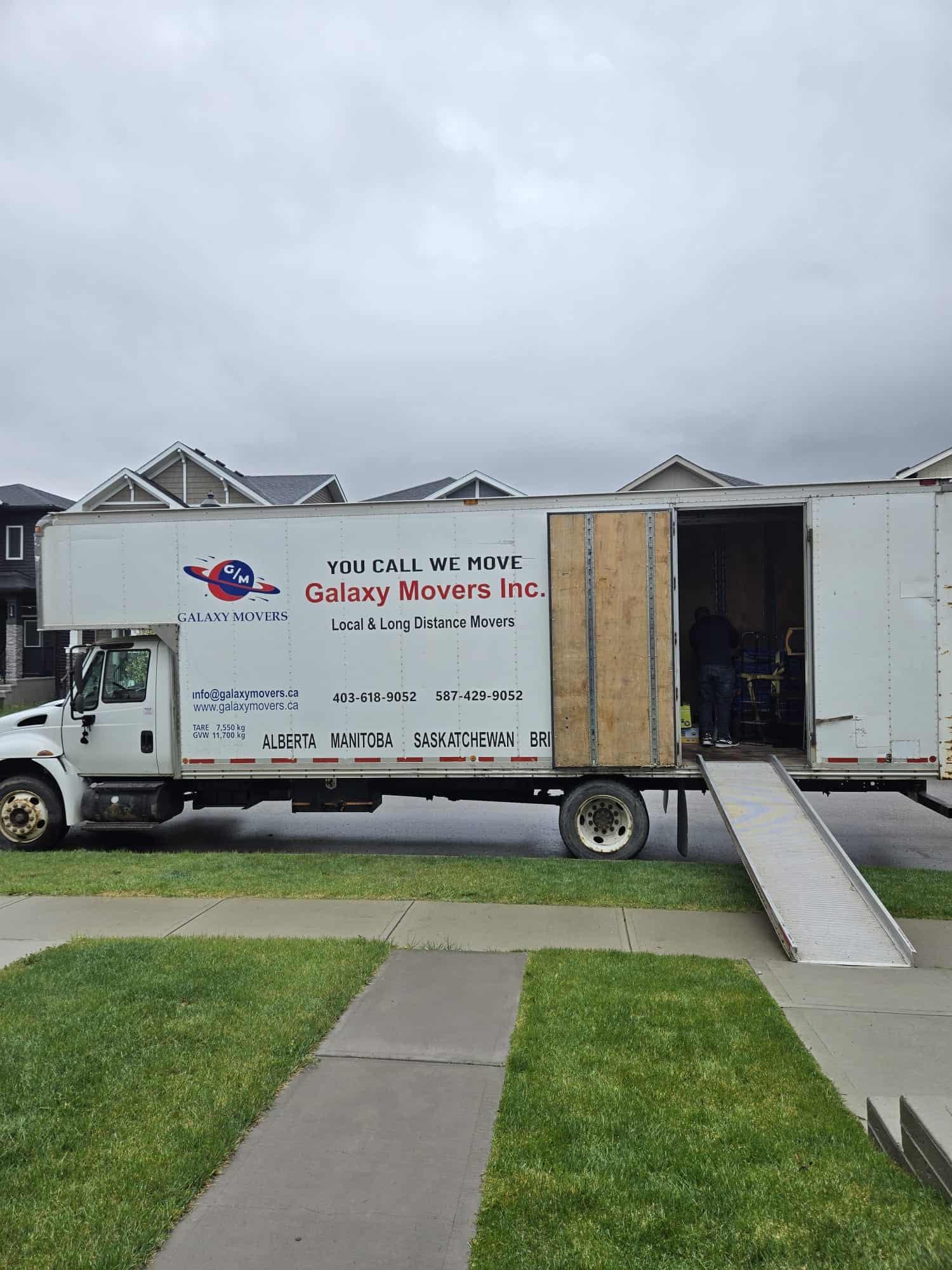 Moving truck with Galaxy Movers logo in Spruce Grove