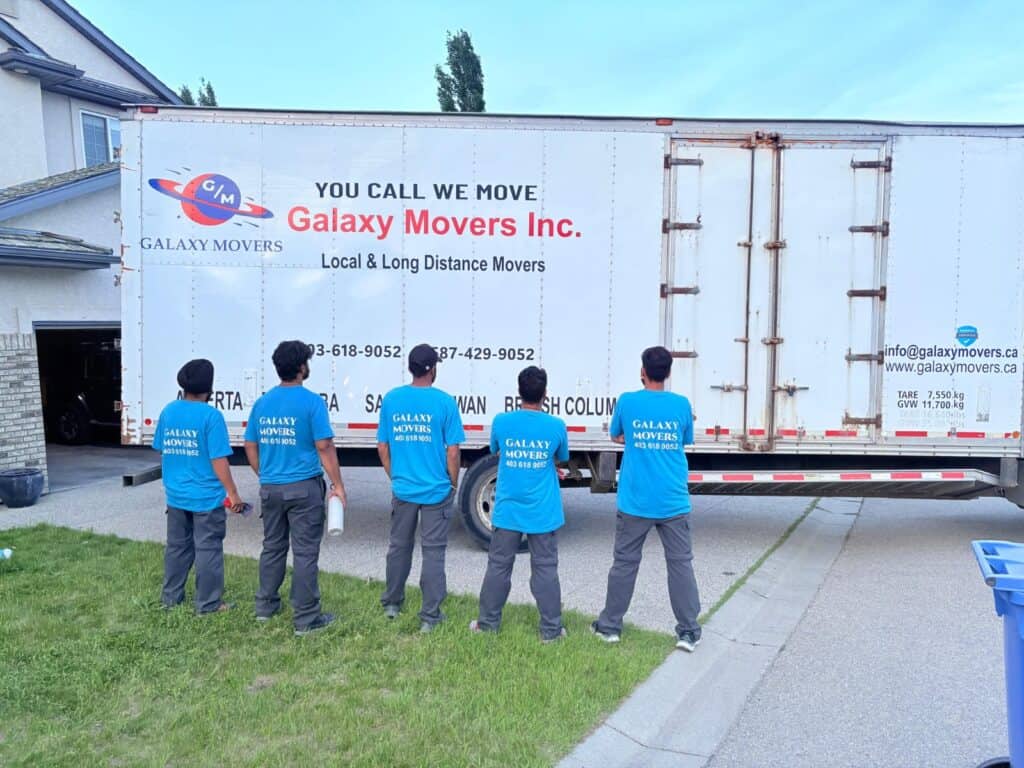 Galaxy Movers team standing by a moving truck in Edmonton